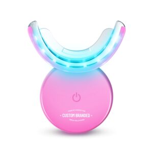A pink LED teeth whitening device with a U-shaped mouthpiece.