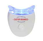Here's an alt tag for the image: Custom branded LED teeth whitening device.
