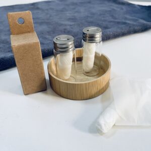 Two glass jars of dental floss.